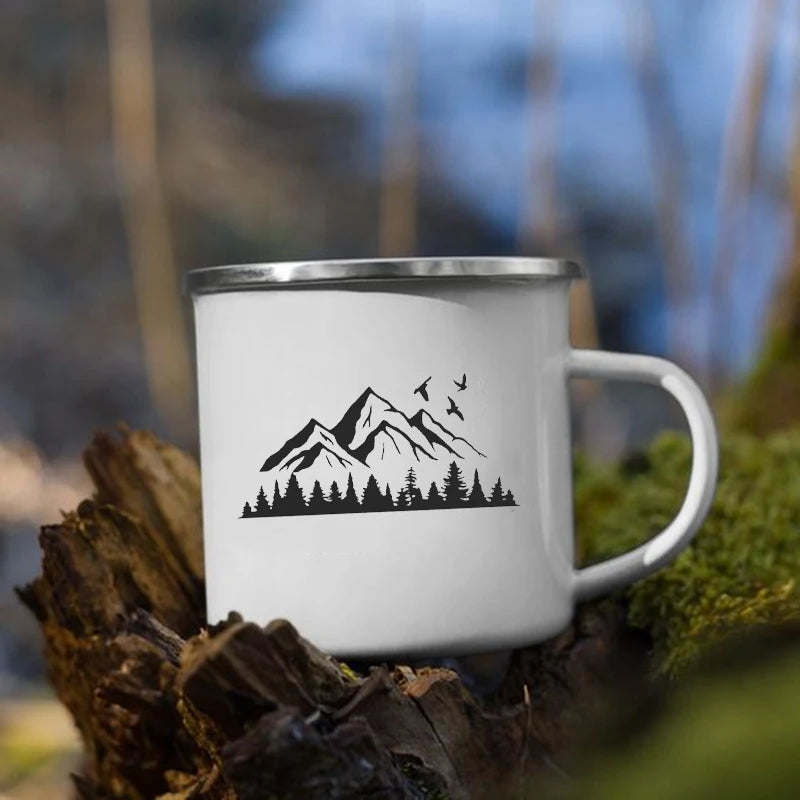 White mug with mountain, trees and birds