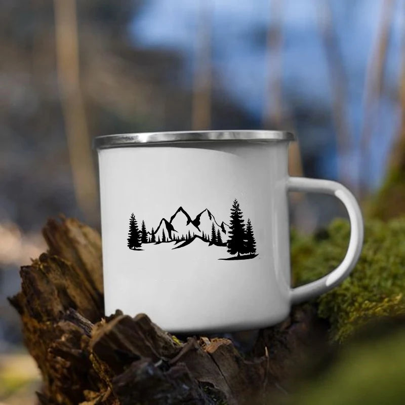 White mug with mountains in the middle and tree design 