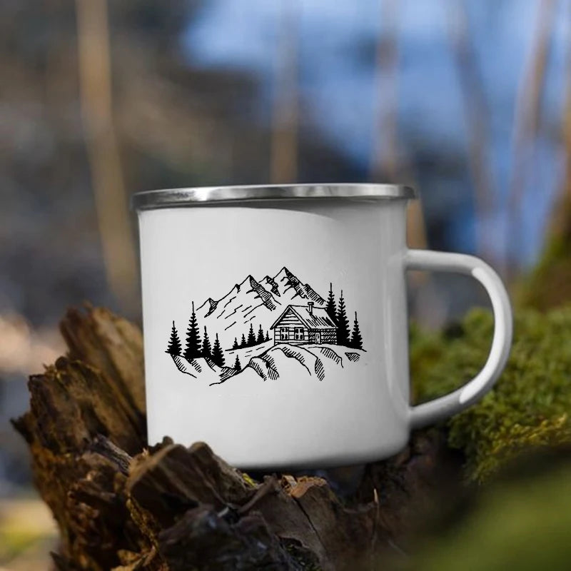 White mug with mountain and cabin design 