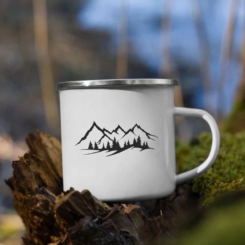 White mug with small mountain peaks and trees